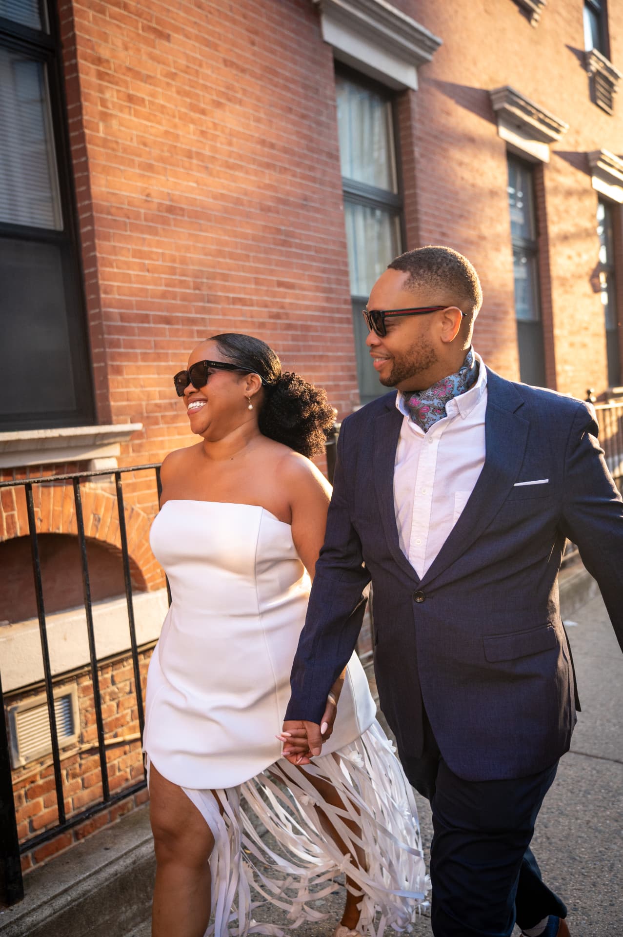 Ashley and Vincent walking together in the afternoon light